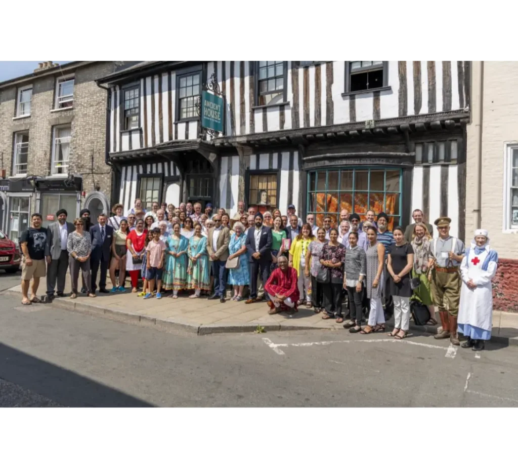 Ancient House Museum in Thetford with a large group of people in front.