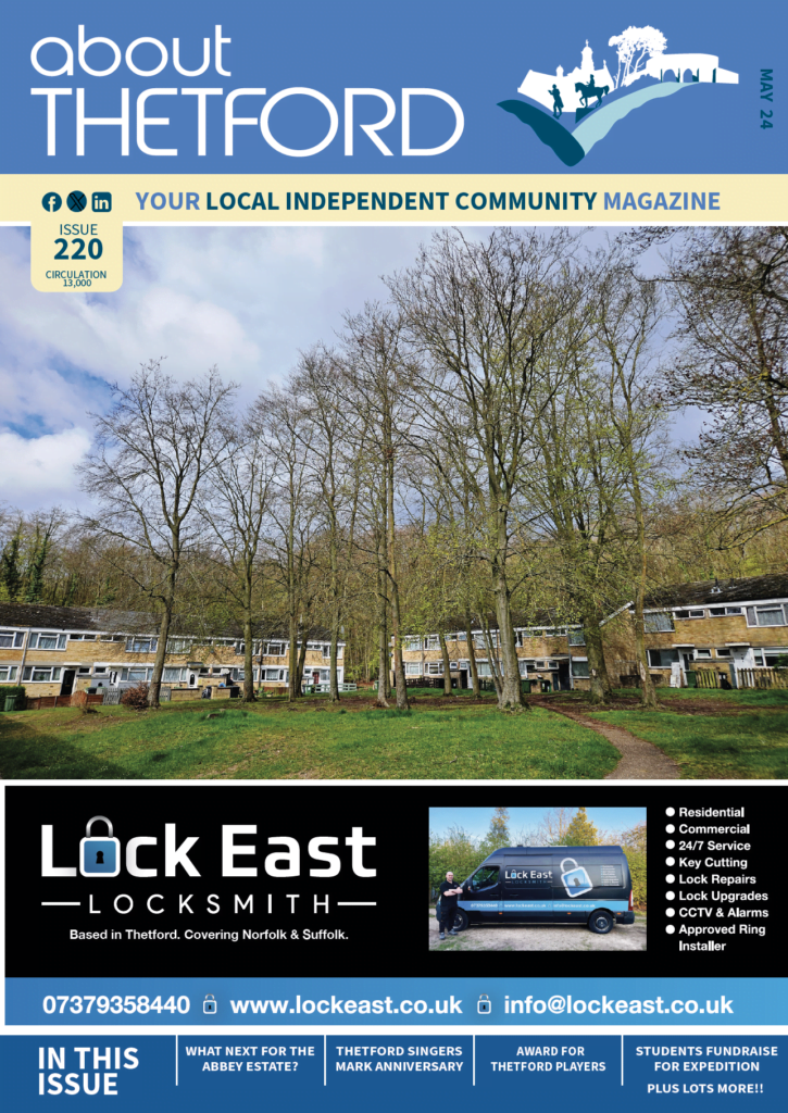 Front cover of May 2024 edition featuring houses on the Abbey estate and trees