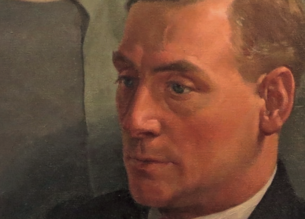 Close-up of an oil painting showing a man’s face in three-quarter view. He has fair skin, neatly combed light brown hair, and blue eyes. His expression is serious and contemplative, and he wears a dark suit with a white shirt. The background is muted and indistinct.