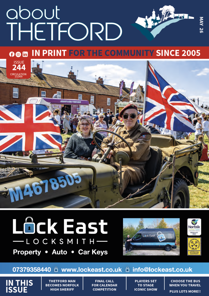 About Thetford magazine cover, Issue 244 (May 2026), with header “In print for the community since 2005.” Main image shows a man and woman riding in a vintage military-style jeep at an outdoor event, both smiling, with Union Flags mounted on the vehicle and a crowd, stalls and houses in the background under a blue sky. Below, a large advert for “Lock East Locksmith” lists services including property, auto and car keys, with a van image and contact details. Footer teasers read: “Thetford man becomes Norfolk High Sheriff,” “Final call for calendar competition,” “Players set to stage iconic show,” and “Choose the bus when you travel – plus lots more.”