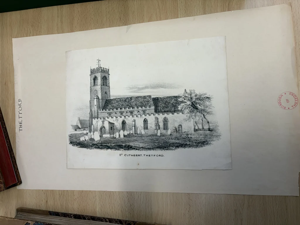 A historic black-and-white illustration of St Cuthbert’s Church in Thetford mounted on archival paper.