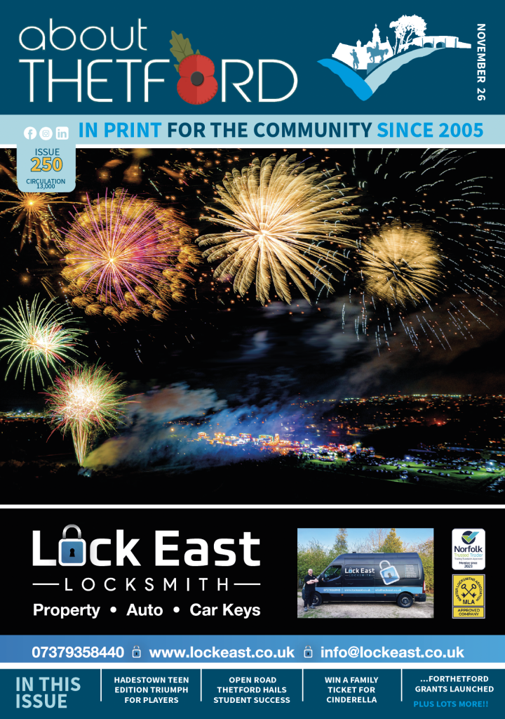 November 2026 cover of About Thetford Magazine, Issue 250, featuring a spectacular fireworks display against a dark night sky. Large bursts of gold, pink, orange, green and blue fireworks illuminate the scene, with smoke drifting above a brightly lit fairground below. The dark teal masthead features the About Thetford logo, incorporating a red remembrance poppy in place of the letter O, alongside the magazine’s illustrated Thetford skyline. A light blue banner reads ‘In Print For The Community Since 2005’, with the issue number 250 and circulation of 13,000 displayed beneath. The lower section features a black advertisement for Lock East Locksmith, including a photograph of the company’s blue van, contact details and accreditation logos. Along the bottom, cover lines highlight Thetford Players’ Hadestown: Teen Edition triumph, Thetford Rails students’ success at the Open Road, a competition to win a family ticket for Cinderella, and the launch of ...forThetford grants.